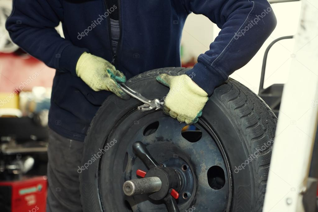 depositphotos 14628087 stock photo changing a tire in a